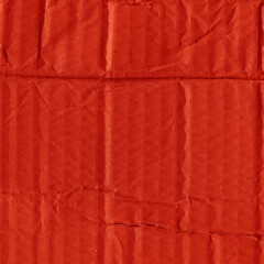 A red vintage rough sheet of carton. Recycled environmentally friendly cardboard paper texture. Simple and bright minimalist papercraft background.
