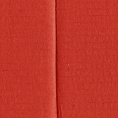 Fototapeta premium A red vintage rough sheet of carton. Recycled environmentally friendly cardboard paper texture. Simple and bright minimalist papercraft background. 