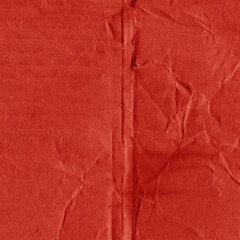 A red vintage rough sheet of carton. Recycled environmentally friendly cardboard paper texture. Simple and bright minimalist papercraft background.
