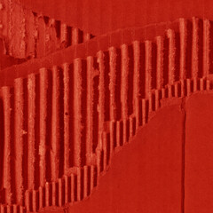 A red vintage rough sheet of carton. Recycled environmentally friendly cardboard paper texture. Simple and bright minimalist papercraft background.