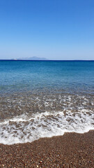 Blue Aegean sea and beach background. Aqua sea water surface. Sea surface view.