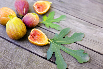 Pink fresh figs on the old wooden table.