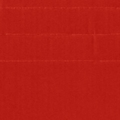 A red vintage rough sheet of carton. Recycled environmentally friendly cardboard paper texture. Simple and bright minimalist papercraft background.