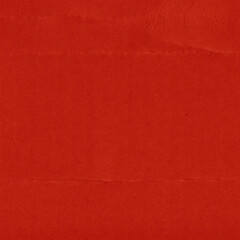 A red vintage rough sheet of carton. Recycled environmentally friendly cardboard paper texture. Simple and bright minimalist papercraft background.