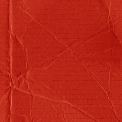 A red vintage rough sheet of carton. Recycled environmentally friendly cardboard paper texture. Simple and bright minimalist papercraft background.