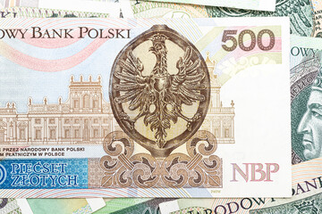 Macro photo of the rear side of a rare Polish PLN 500 banknote, close-up on the inscriptions.