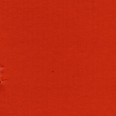 A red vintage rough sheet of carton. Recycled environmentally friendly cardboard paper texture. Simple and bright minimalist papercraft background.