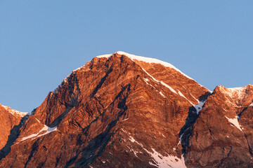 Sunrise on monte rosa and its glaciers, seen from the town of Macugnaga, Italy - July 2020.