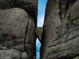 Rock formation called Slonecznik (Sunflower) in Karkonosze Mountains. Poland. Small rock stucked between two ginat ones.