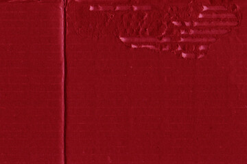 A red vintage rough sheet of carton. Recycled environmentally friendly cardboard paper texture. Simple and bright minimalist papercraft background.