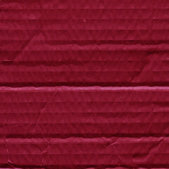 Fototapeta premium A red vintage rough sheet of carton. Recycled environmentally friendly cardboard paper texture. Simple and bright minimalist papercraft background.