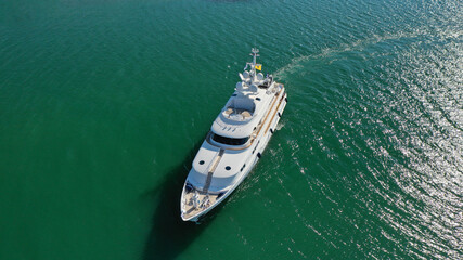 Aerial drone photo of luxury yacht cruising to Athens Marina and port in Piraeus, Attica, Greece