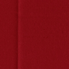A red vintage rough sheet of carton. Recycled environmentally friendly cardboard paper texture. Simple and bright minimalist papercraft background.