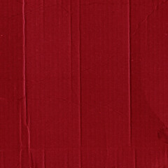 Fototapeta premium A red vintage rough sheet of carton. Recycled environmentally friendly cardboard paper texture. Simple and bright minimalist papercraft background.