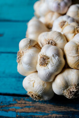 garlic bunch on a blue wooden table