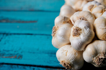 garlic bunch on a blue wooden table