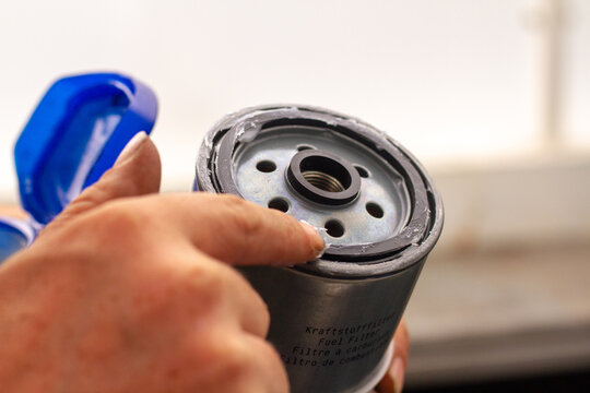Greasing the o-ring on a fuel filter