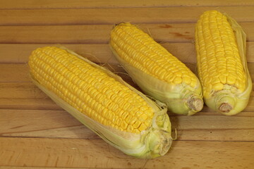 Corn cobs on a wooden table