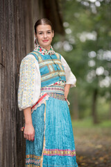 Slovak folklore. Traditional costume. Beautiful girl in traditional dress.