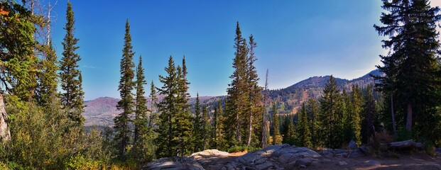 Lake Mary Martha and Catherine hiking trail views to Sunset Peak on the Great Western Trail by Brighton, fall autumn colors. Rocky Mountains, Wasatch Front, Utah. United States.