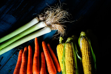 leek carrot corn on wooden blue table top view