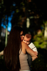 woman on her back hugging her son