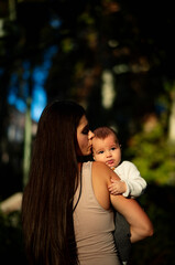 Naklejka premium woman on her back hugging her son