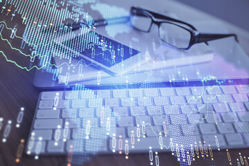 Obraz premium Double exposure of forex chart drawing and cell phone background. Concept of financial trading