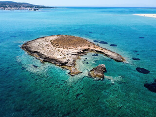 Aerial panoramic view of Pavlopetri islet near Pounda exotic beach in Lakonia