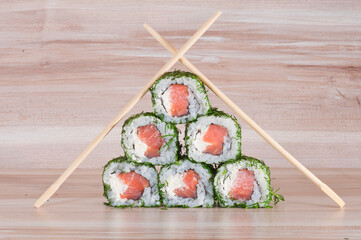 Maki Sushi on wooden background