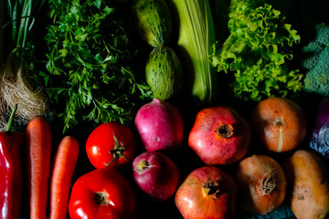 red and green fresh vegetables fruits on blue wood
