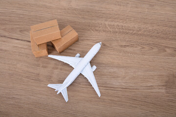 An airplane model and a courier shipping box model on the table