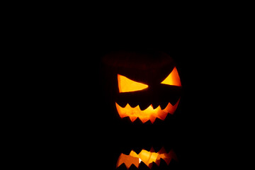Fototapeta premium Jack o Lantern on a black background.