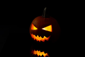 Jack o Lantern on a black background.