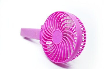 Pink portable fan, isolated on white background. Modem portable mini fan gadget. 
