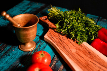 tomato potato pepper mortar on wooden table