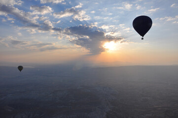 Silhouette of hot air balloons at sunrise over Cappadocia, Turkey