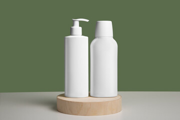 set of cosmetic bottles for liquid, cream, gel, lotion. Cosmetics package, blank templates of transparent and white plastic containers. Green background