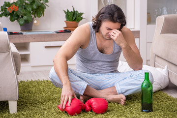 Male ex-champion boxer suffering from alcoholism at home