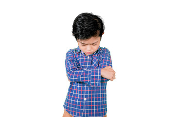 Little boy standing with sad expression on studio
