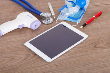 iPad and various medical supplies on the table