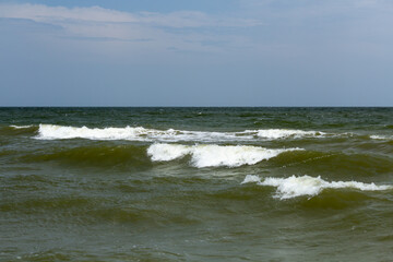 waves with crests on the sea surface, use as a background or texture
