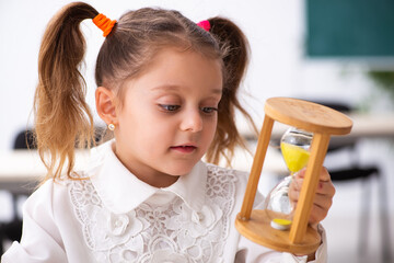 Small girl in time management concept