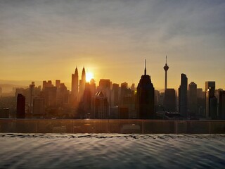 Obraz premium Malaysia, perfect view to a capital city. Kuala Lumpur is a powerhouse financial and business hub in South East Asia. The most famous are Petronas Twin Towers (the world's tallest twin skyscrapers). 