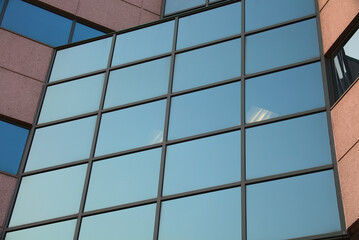 Fototapeta premium building facade square windows and concrete walls business skyscraper