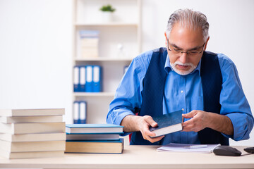 Old male author writing books