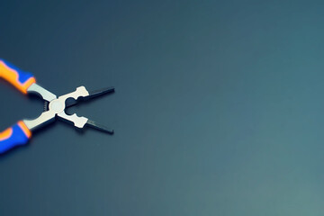 Multifunction pliers on a table as background