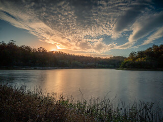 Lakeside Sunset with Cloud Reflections