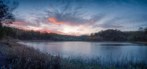 Beautiful Panoramic Lakeside Sunset with Cloud Reflections