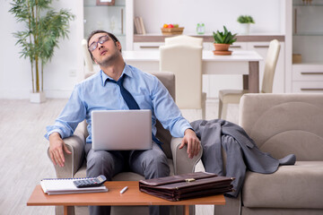 Fototapeta premium Tired businessman employee working from home